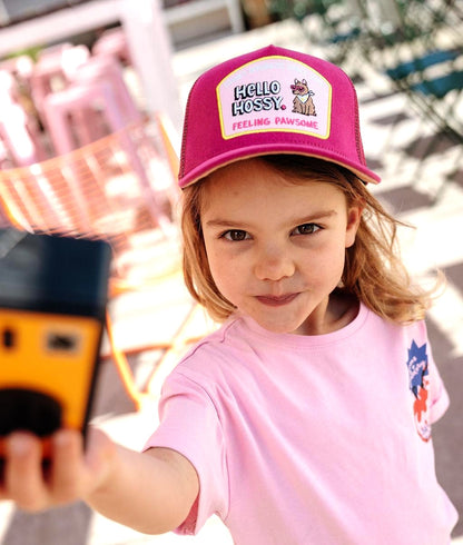 Child wearing fuchsia curved brim cap Hello Hossy