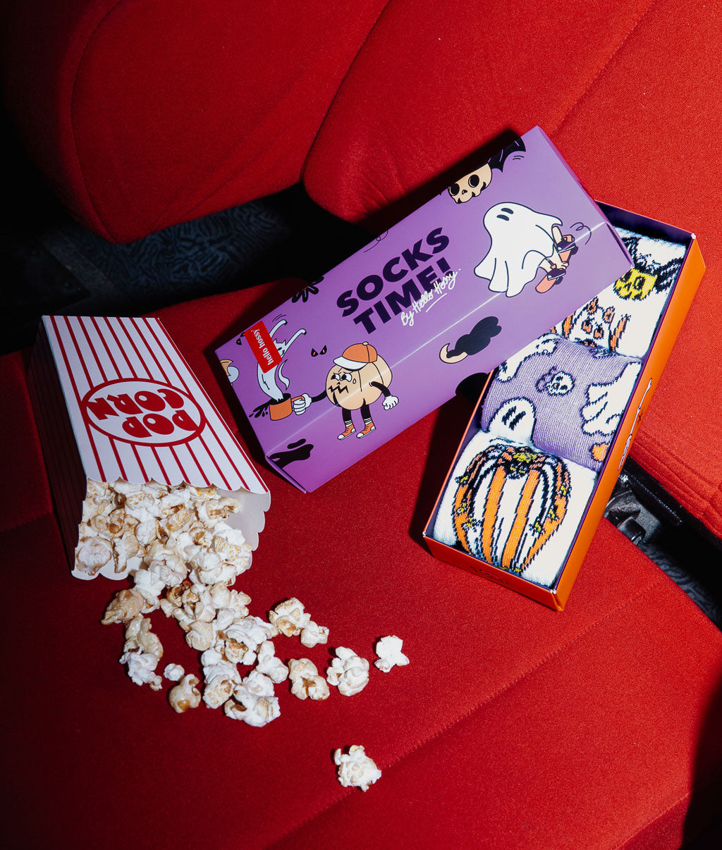 Pack of kids' socks with colourful Halloween patterns in a Hello Hossy gift box