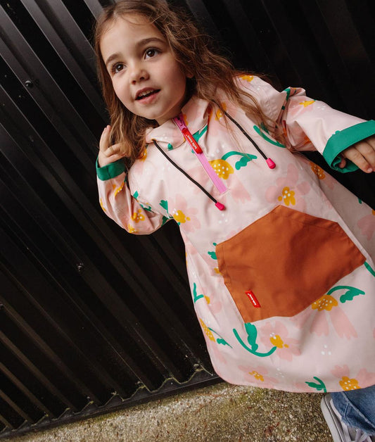 Children's pink patterned flower rain poncho with Camel pocket Hello Hossy