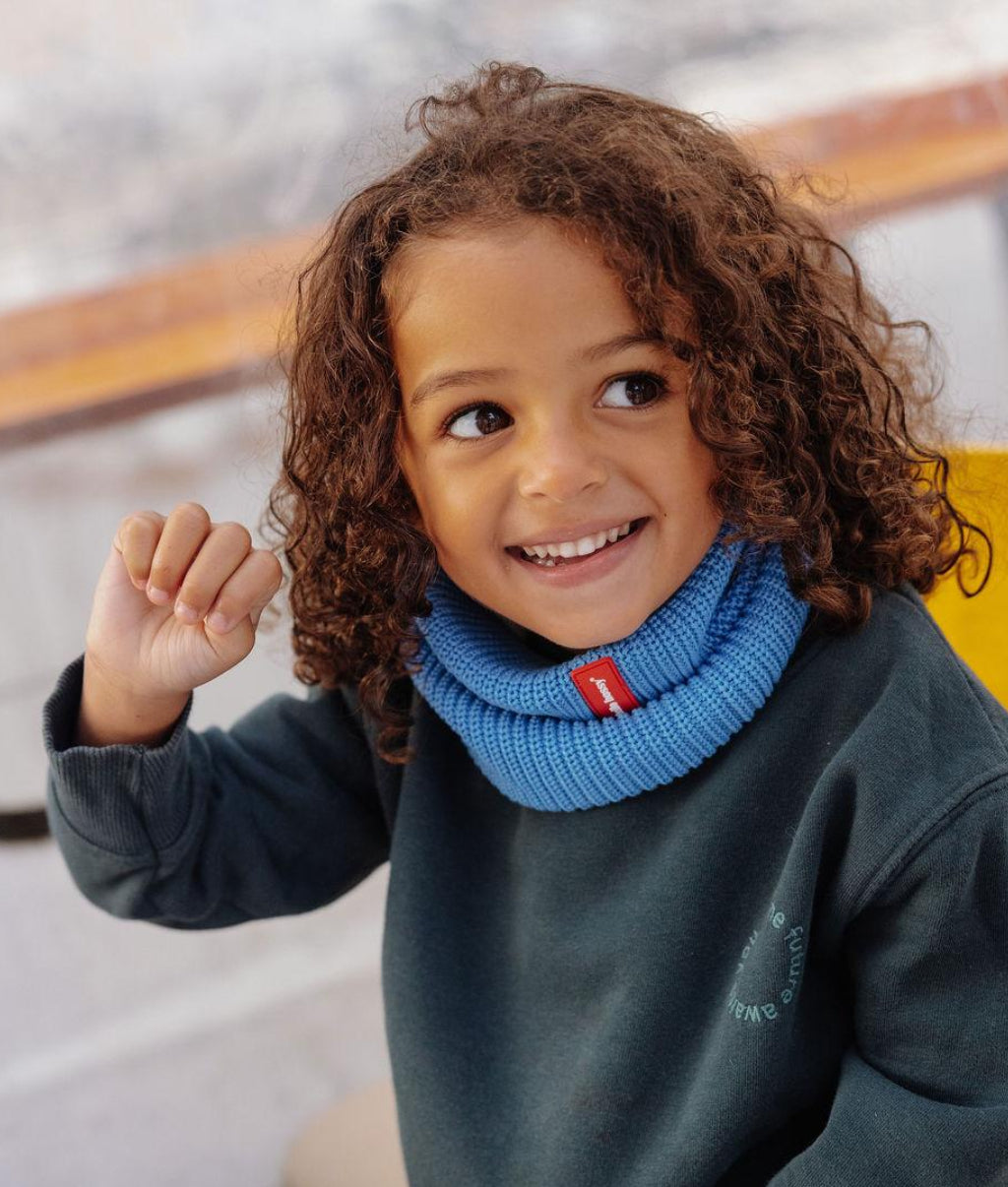 Child wearing blue cotton fine knit Snood red detail Hello Hossy