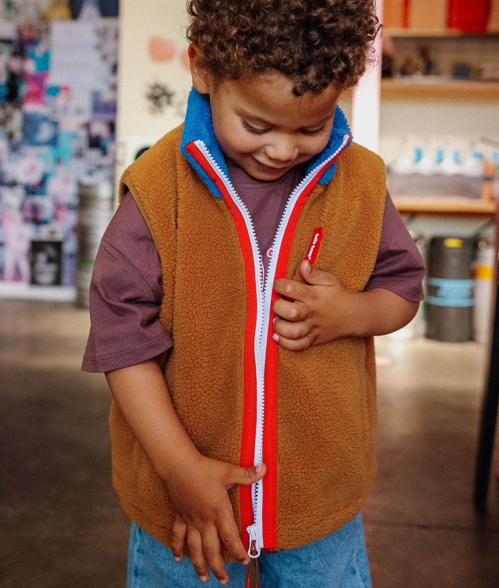 Kids' Camel and blue fleece vest with high collar and red zip Hello Hossy